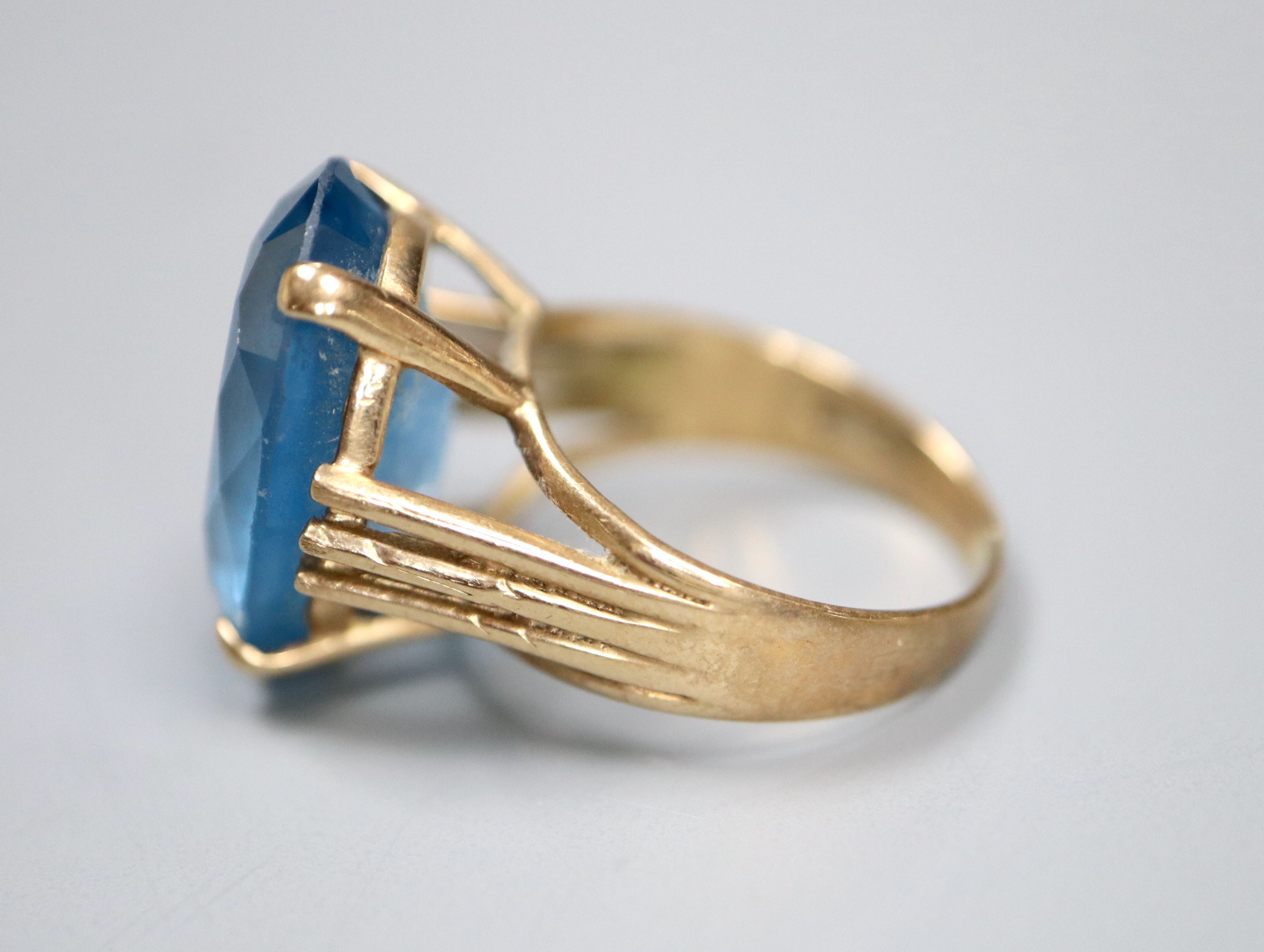 A modern 9ct gold and blue paste? set oval dress ring, size K, gross 5.5 grams.